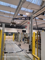 Tower pallet wrapping machine with conveyor belts